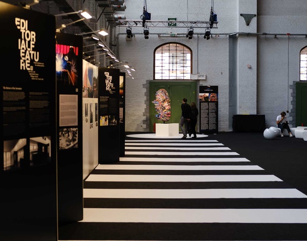 Brussels expo event hall with black and white striped carpet pathway